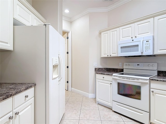 kitchen featuring light tile patterned floors, white appliances, white cabinetry, dark countertops, and crown molding