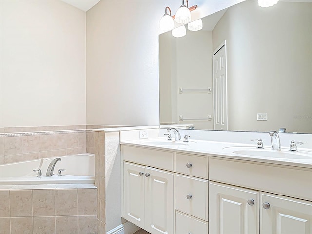 full bath with double vanity, a garden tub, and a sink