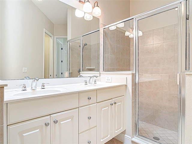 full bathroom with a stall shower, a sink, and double vanity