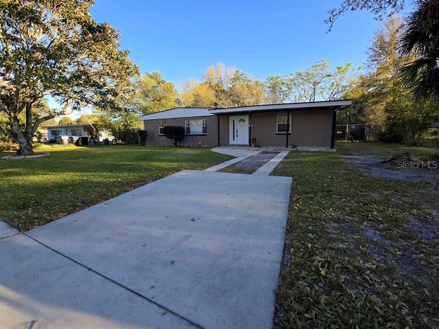 ranch-style house with a front yard