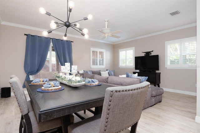 dining area featuring light wood-type flooring, visible vents, and ornamental molding