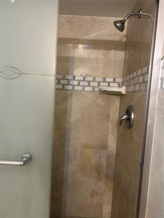 bathroom with a shower stall