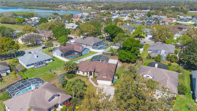 birds eye view of property with a residential view and a water view