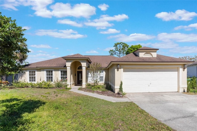 view of front of property with a front lawn, a garage, driveway, and stucco siding