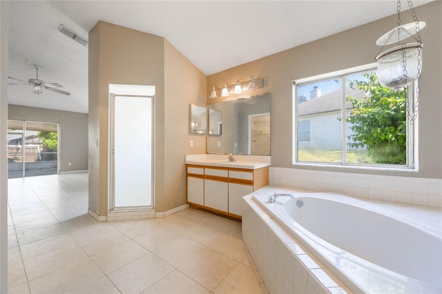 full bathroom with lofted ceiling, a garden tub, visible vents, and plenty of natural light