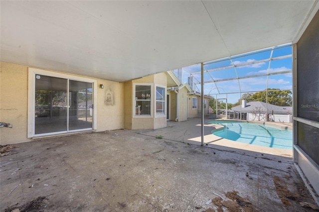 outdoor pool featuring a lanai and a patio area