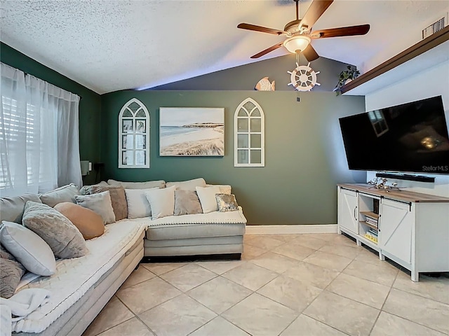 living room with light tile patterned floors, lofted ceiling, visible vents, ceiling fan, and baseboards