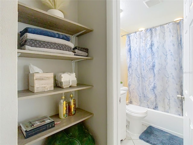 full bath featuring visible vents, shower / bath combo, toilet, and tile patterned floors