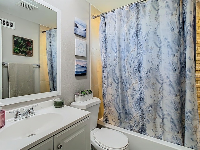 full bathroom featuring toilet, vanity, visible vents, and shower / tub combo with curtain