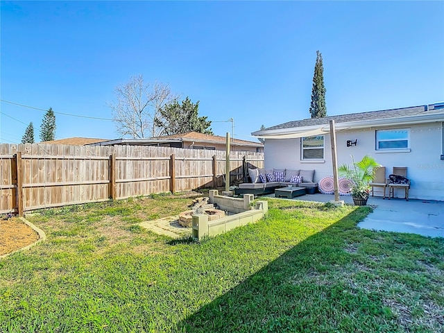 view of yard with an outdoor hangout area, a vegetable garden, a patio, and fence