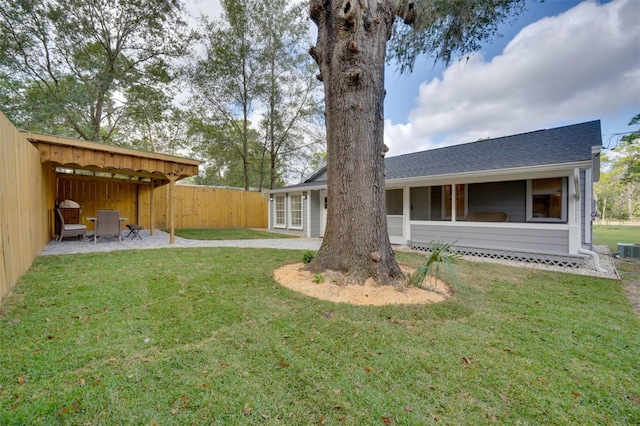 view of yard with fence and a patio