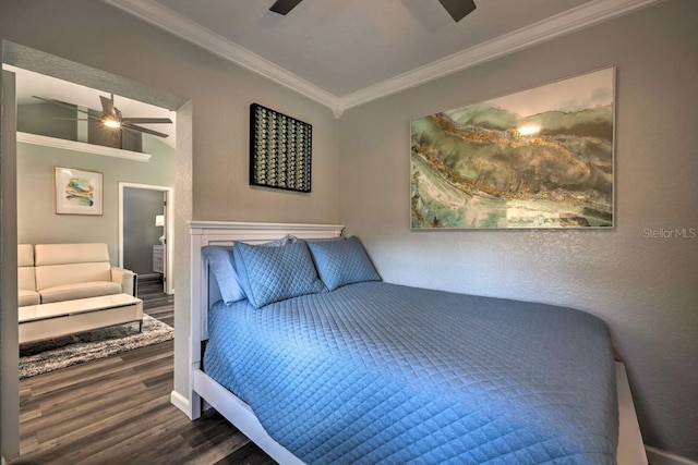 bedroom featuring ceiling fan, wood finished floors, lofted ceiling, and crown molding