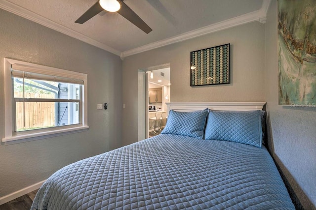 bedroom with baseboards, a ceiling fan, a textured wall, ornamental molding, and wood finished floors