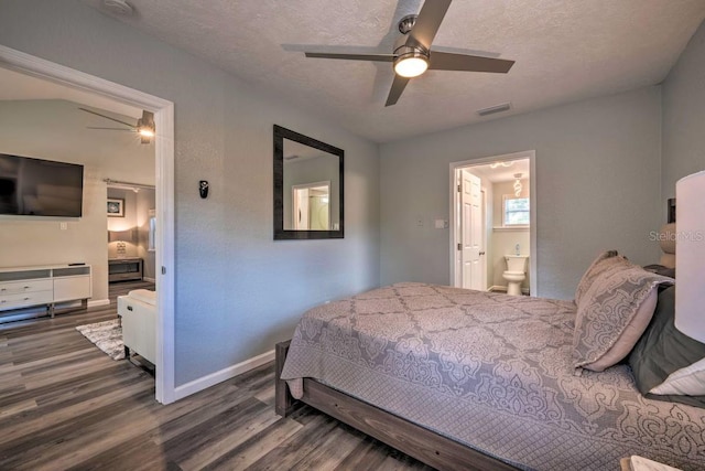 bedroom with visible vents, connected bathroom, a textured ceiling, wood finished floors, and baseboards