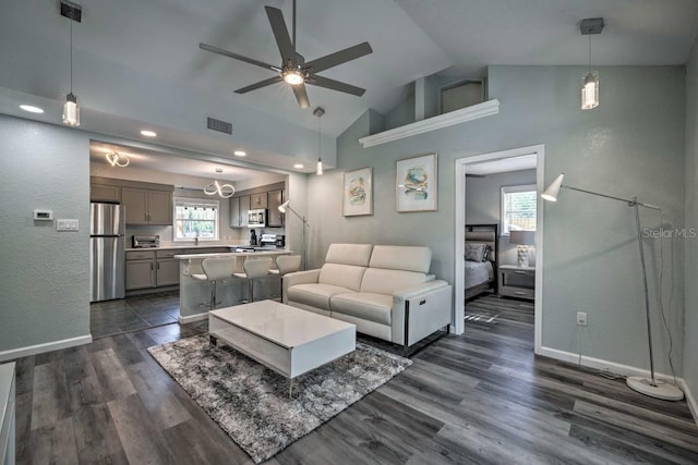 living room featuring baseboards, visible vents, ceiling fan, and dark wood-style flooring