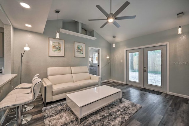 living room featuring french doors, dark wood-style flooring, lofted ceiling, a ceiling fan, and baseboards