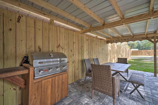 view of patio featuring grilling area and outdoor dining space