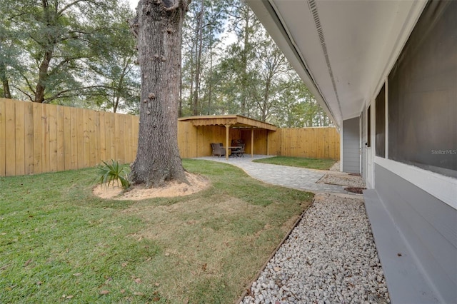 view of yard with a patio area and a fenced backyard