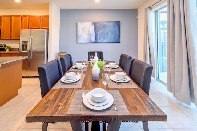 dining room with light tile patterned floors and recessed lighting