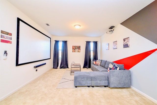 cinema featuring carpet floors, visible vents, and baseboards