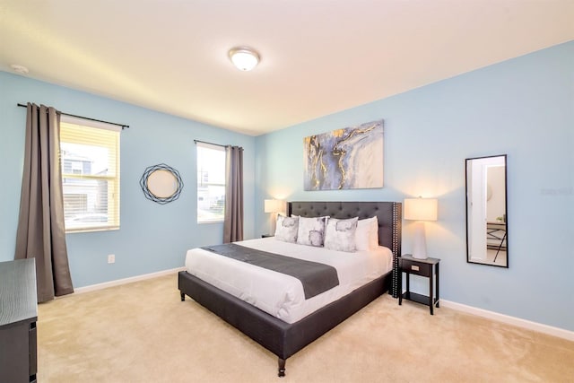 bedroom with carpet and baseboards