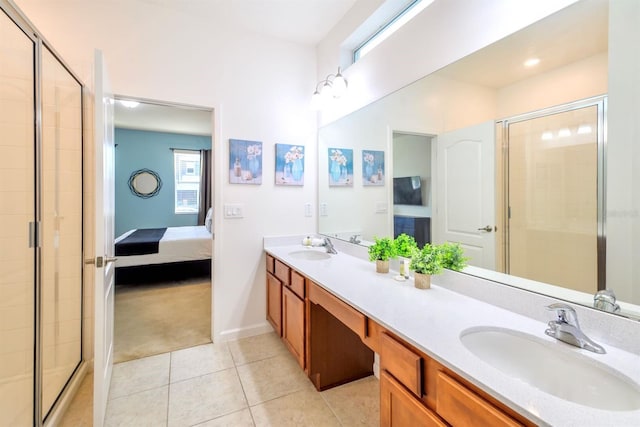 full bathroom featuring a shower stall, a sink, and tile patterned floors