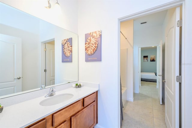 bathroom with tile patterned floors, visible vents, and vanity