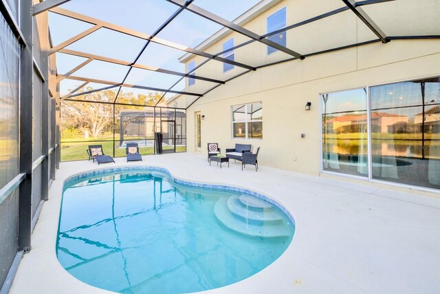 pool featuring a patio area and a lanai