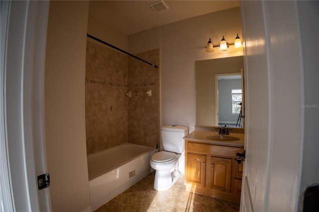 bathroom featuring shower / washtub combination, visible vents, toilet, vanity, and tile patterned flooring