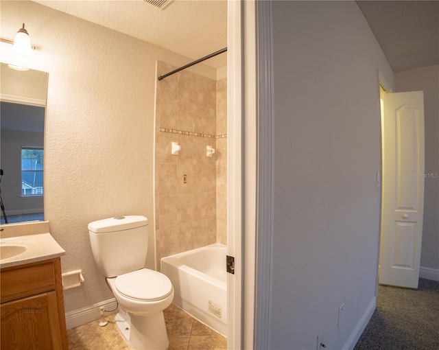 full bathroom featuring toilet, vanity, baseboards,  shower combination, and tile patterned floors