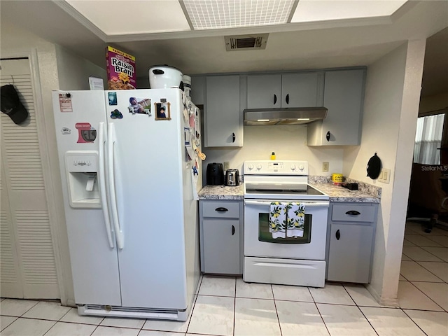 kitchen featuring light countertops, white appliances, gray cabinets, and under cabinet range hood