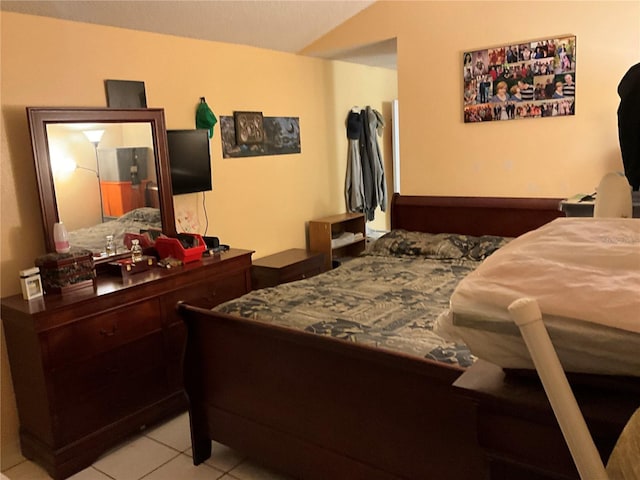 bedroom featuring light tile patterned floors