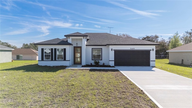 view of front of home with an attached garage, driveway, roof with shingles, stucco siding, and a front yard