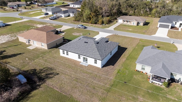 birds eye view of property with a residential view