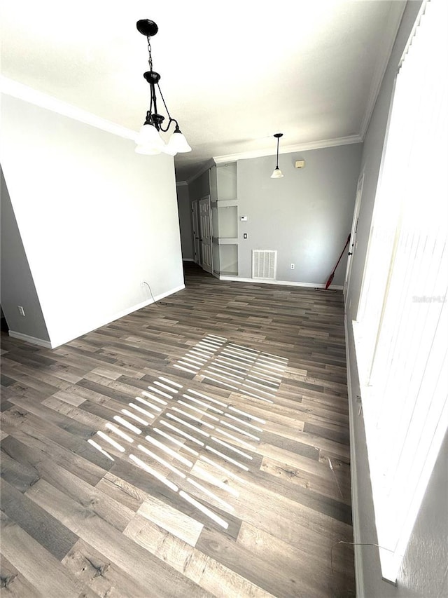 3206 Valerie Blvd, Sebring, FL 33870 - interior space featuring baseboards, visible vents, dark wood finished floors, and crown molding