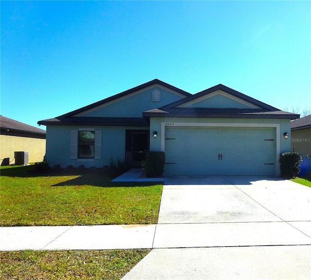 single story home featuring driveway, a garage, a front lawn, and stucco siding