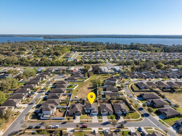 bird's eye view featuring a water view and a residential view