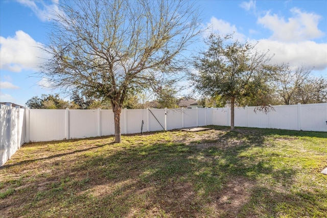 view of yard with a fenced backyard