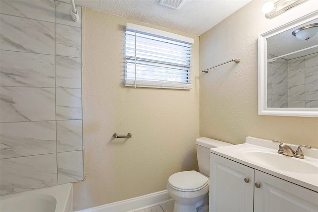 bathroom with vanity, toilet, visible vents, and a textured ceiling