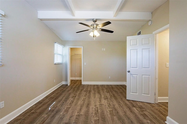 unfurnished bedroom with vaulted ceiling with beams, wood finished floors, and baseboards