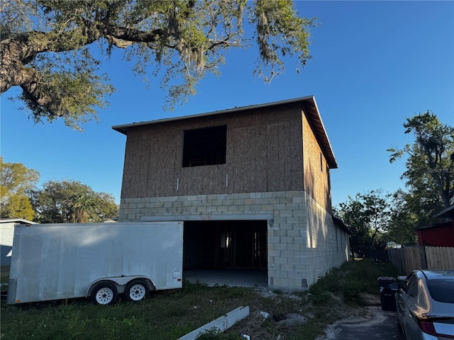 exterior space featuring an outdoor structure and an attached garage