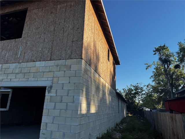 view of home's exterior with fence