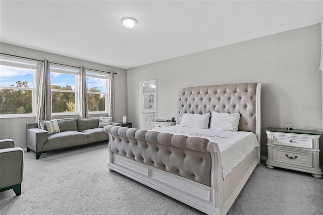 bedroom featuring light carpet