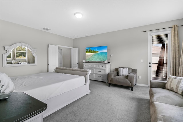 bedroom featuring light carpet, access to outside, visible vents, and baseboards