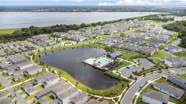 birds eye view of property featuring a residential view and a water view