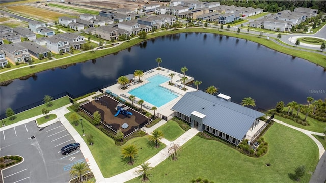 bird's eye view with a water view and a residential view