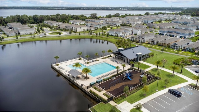 bird's eye view featuring a water view and a residential view