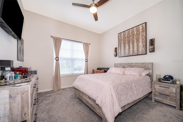 carpeted bedroom featuring ceiling fan, baseboards, and vaulted ceiling