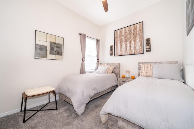 bedroom with ceiling fan, carpet flooring, and baseboards