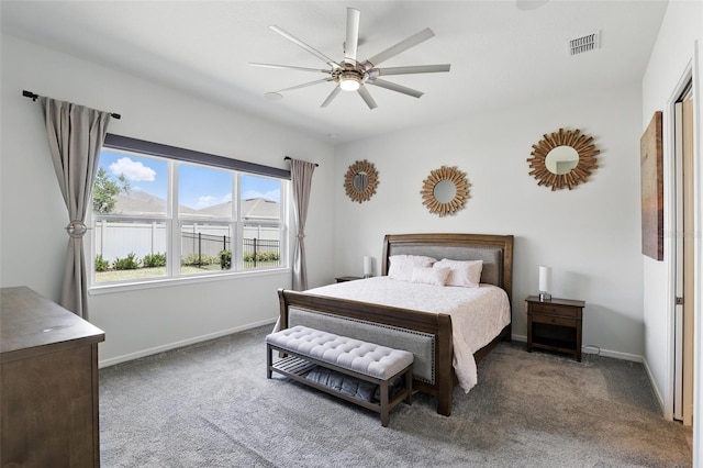carpeted bedroom with baseboards, visible vents, and ceiling fan